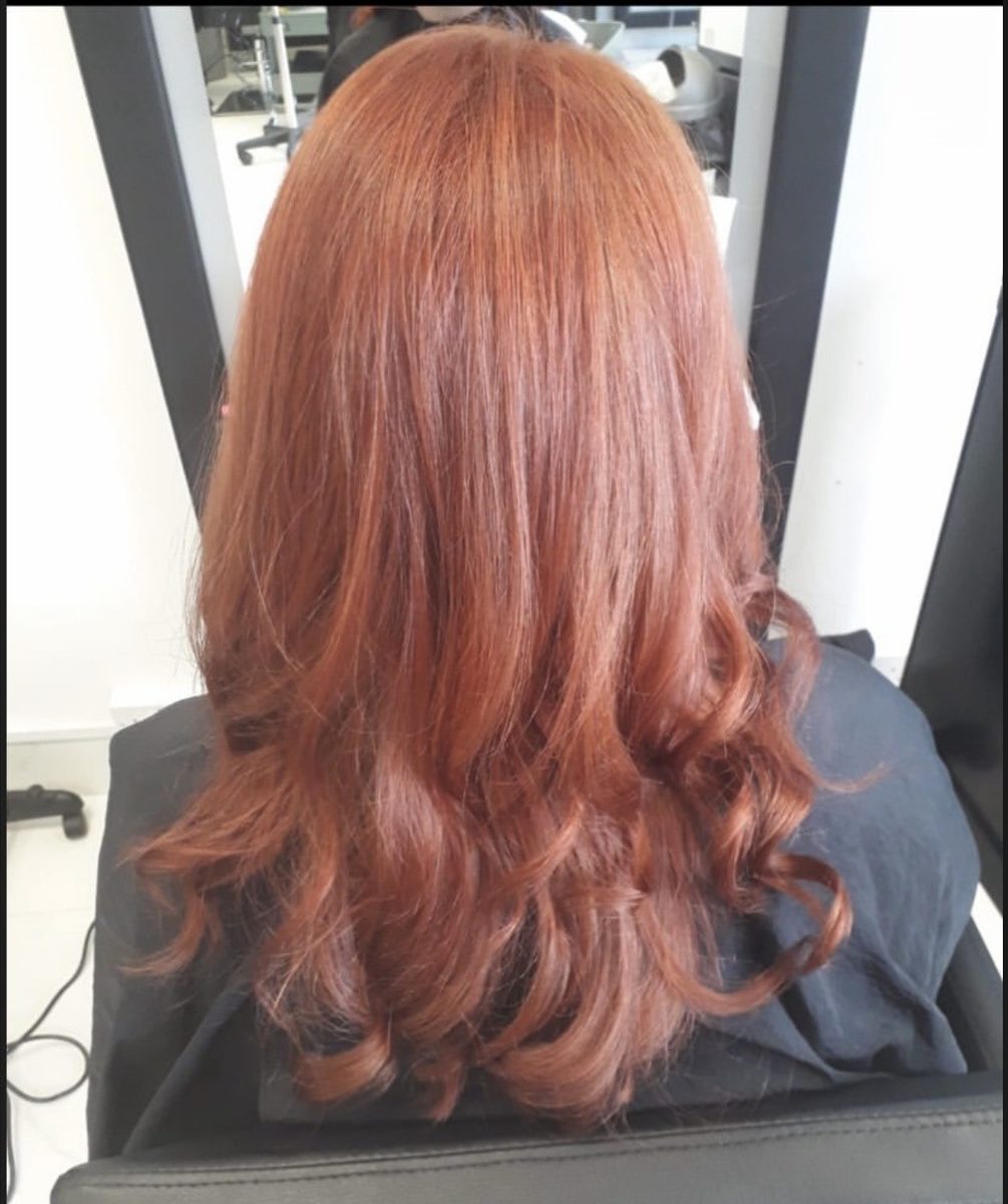 Warm, dimensional copper colour with soft grown-out roots at INCH Hair Design